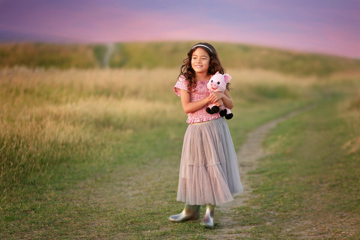 Girl with her toy in Nose Hill Park