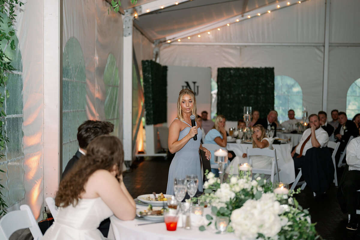 Classic black-and-white wedding reception décor with tall greenery centerpieces at The Morris Estate.