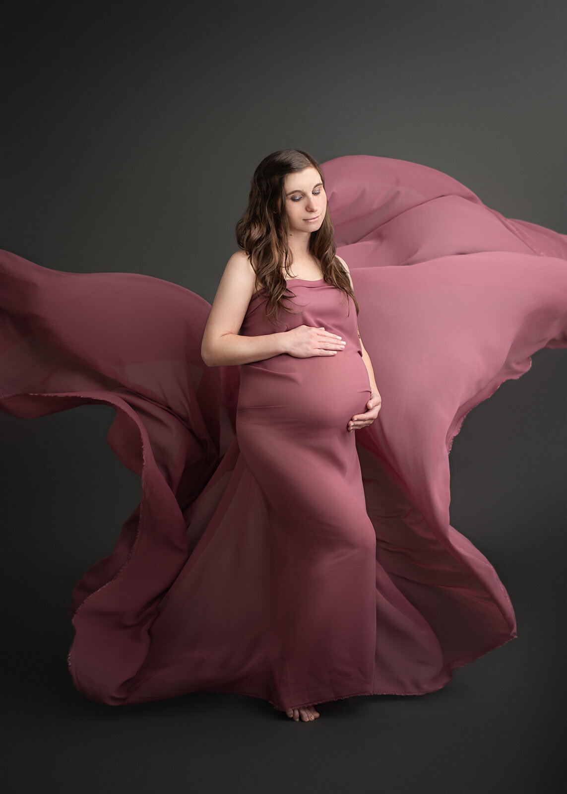 mom in purple draping fabric by st. louis maternity photographer