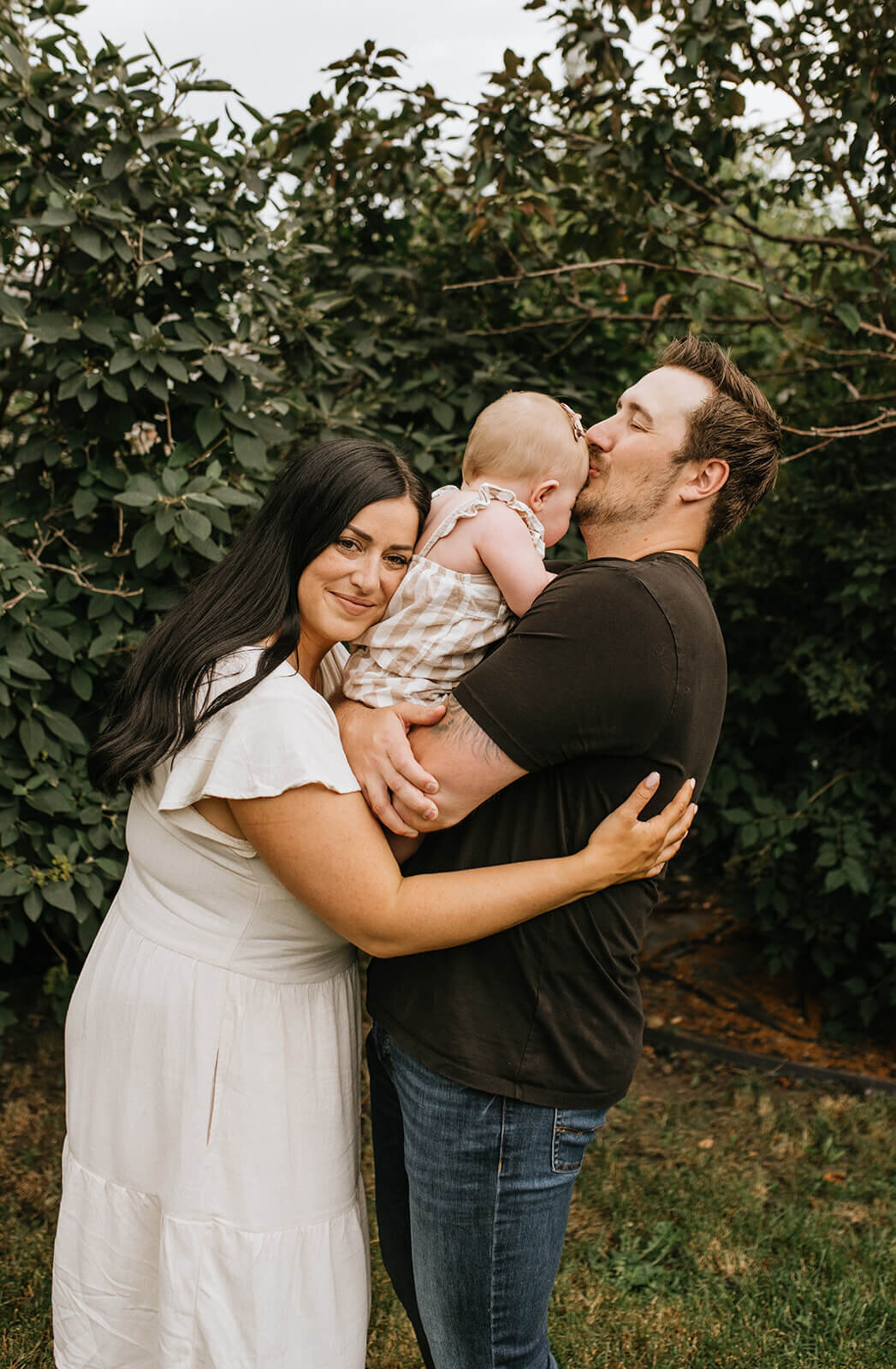 Family-hugging-baby-girl