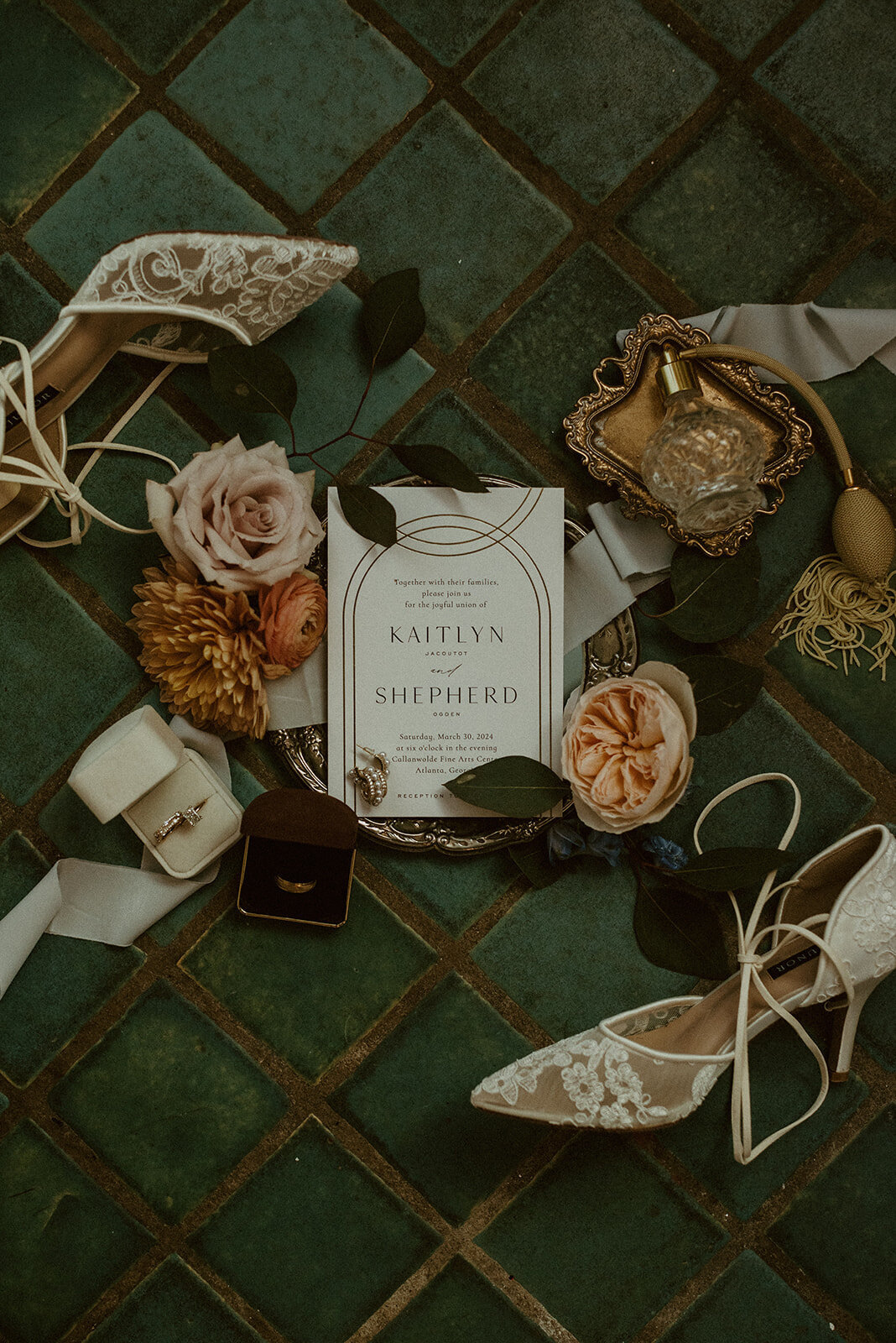 wedding flat lay with art deco details and blue tile 