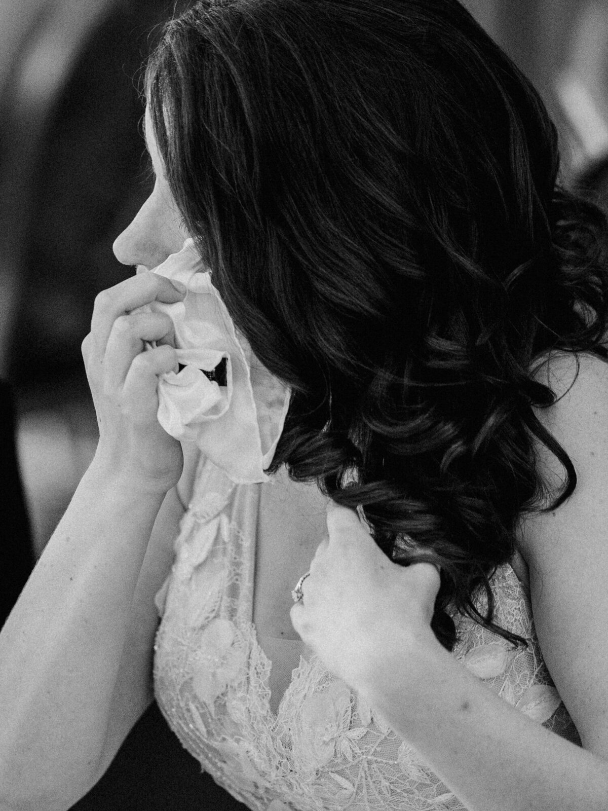 Bride sheds a tear during an emotional wedding reception toast