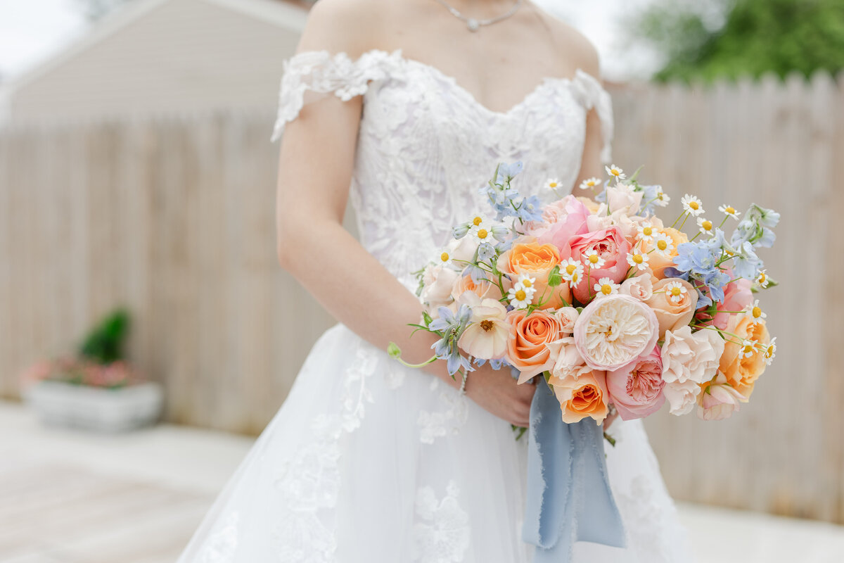 Blush, peach and soft blue wedding flowers at Celebrations at the Bay in Maryland. Custom floral design for weddings and special events near Kent Island, MD.