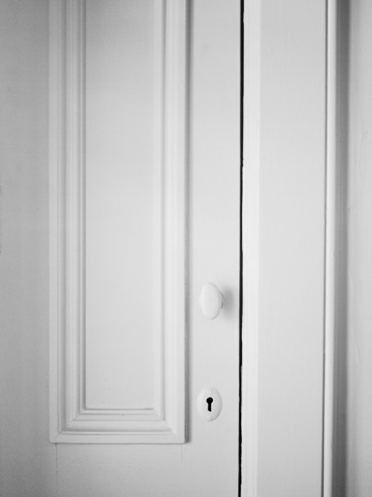 clean white door with historic detail, character, keyhole, Aleo Detroit, Little village