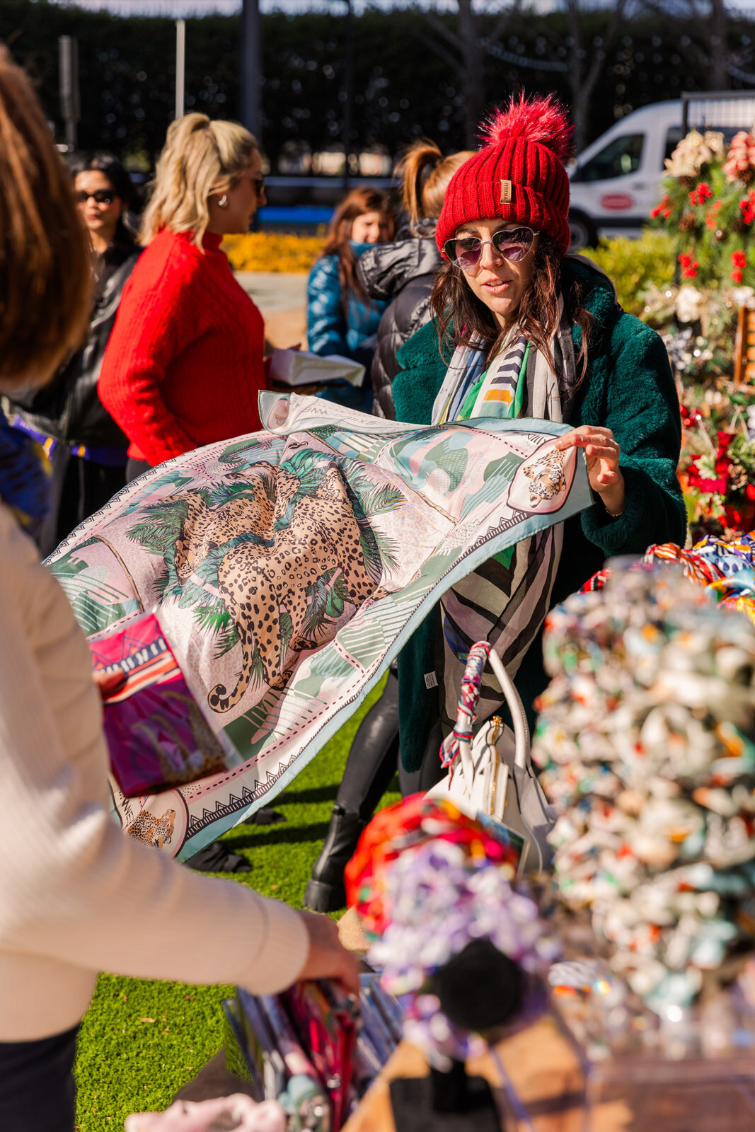 scarf seller showing her products during Atlanta makers market by event photographer Laure Photography