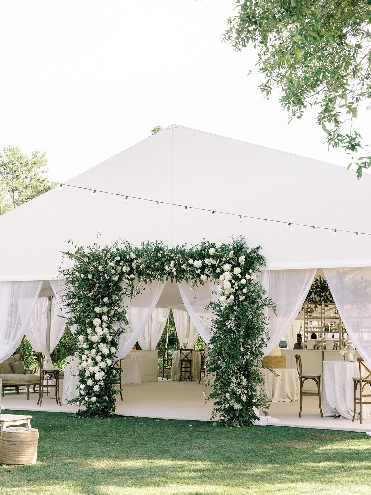 destination-wedding-watercolor-tent-entrance-greenery