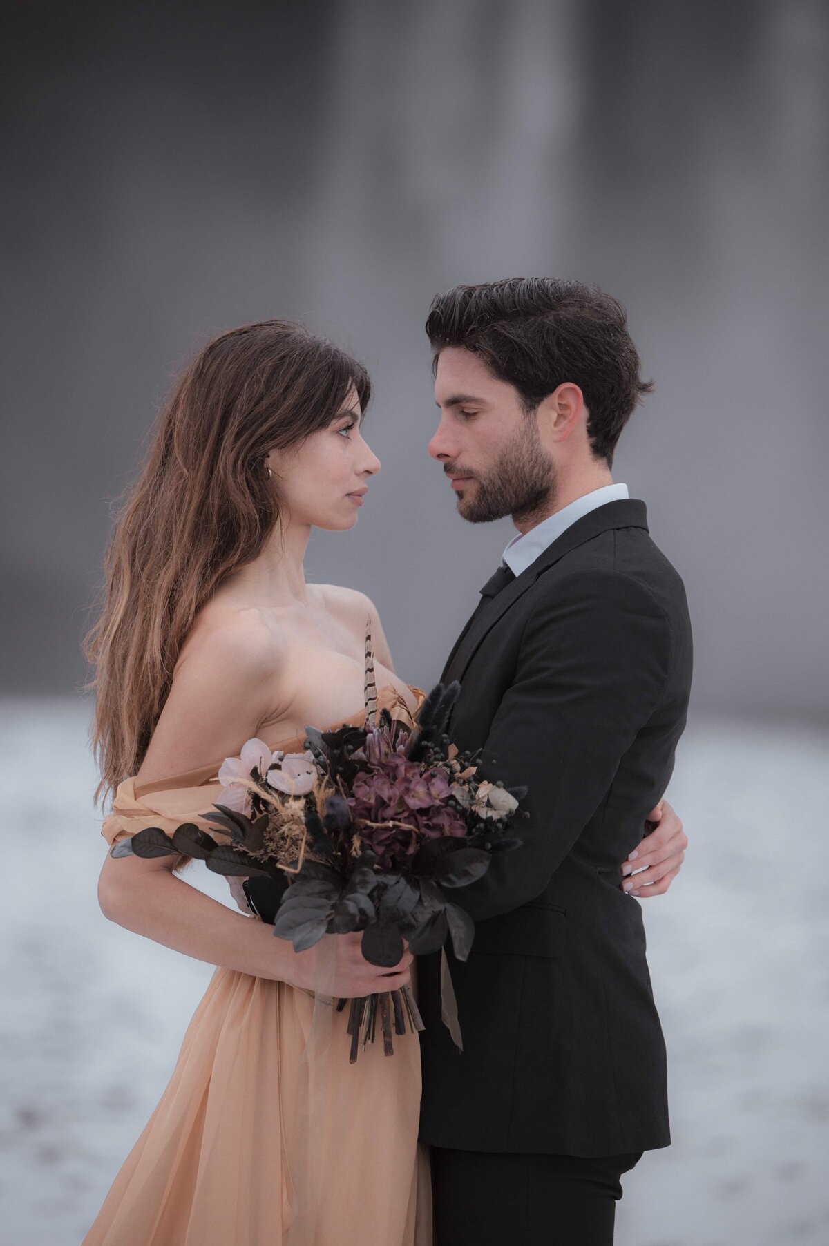 Waterfall wedding photo edited with First Light Collection – soft golden highlights and cinematic contrast for dramatic destination elopements.