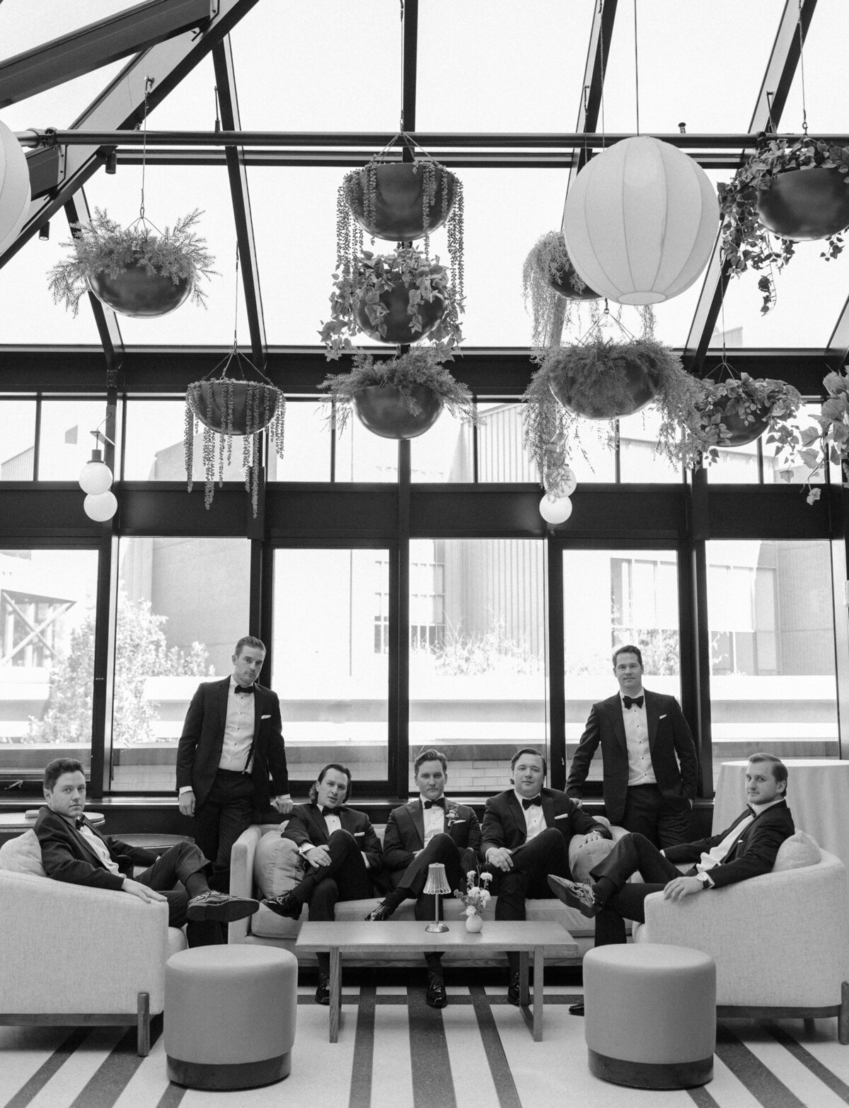 groomsmen portrait on couches at Shinola Hotel, Detroit