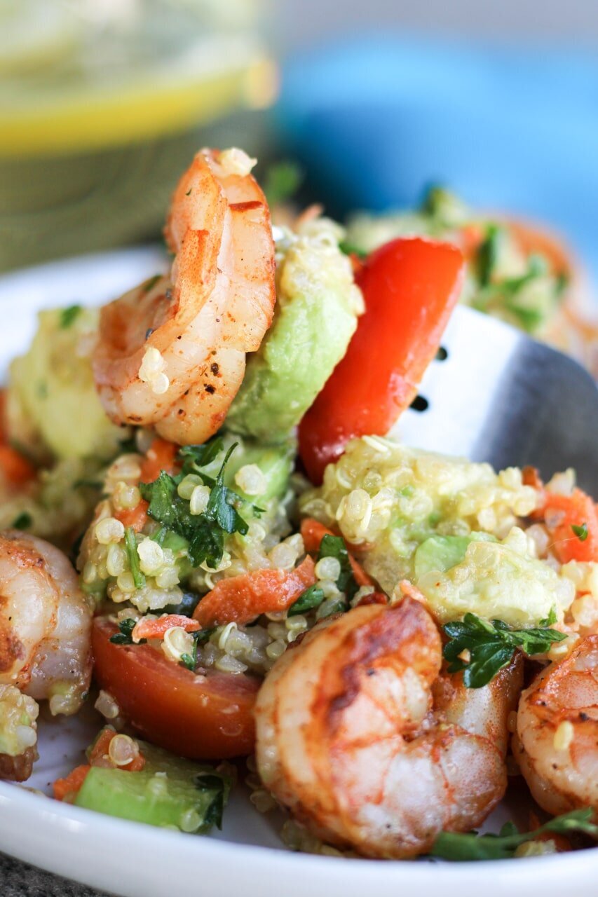 close up of fork in shrimp avocado salad