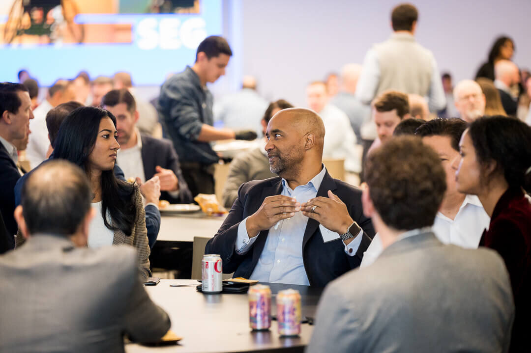 Corporate event photography of small group professionals networking during business meeting new jersey.