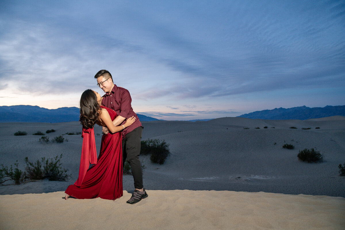Death Valley elopement bride and groom at Mesquite Flat Sand Dunes during sunset.