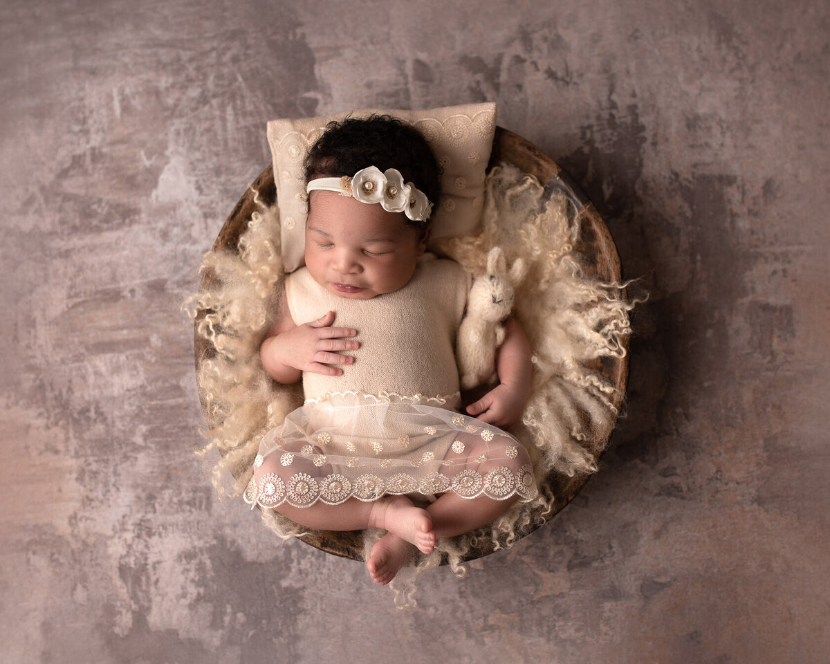 Creative photography of baby in a bucket by Houston Photographer