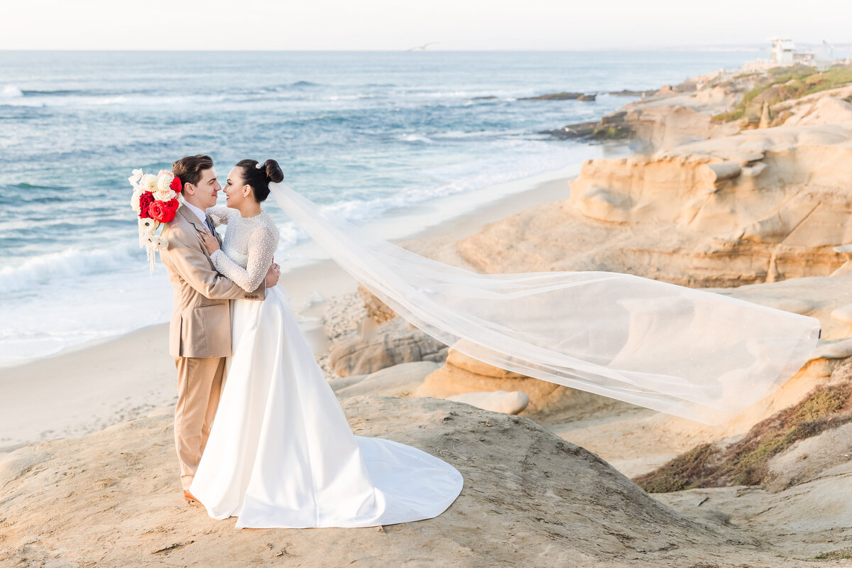 bride-and-groom-la-jolla-cliffs-veil-flying