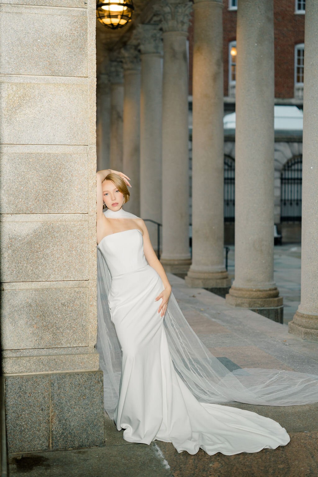 Long pearl detailed bridal scarf adding elegance and drama to a modern wedding style
