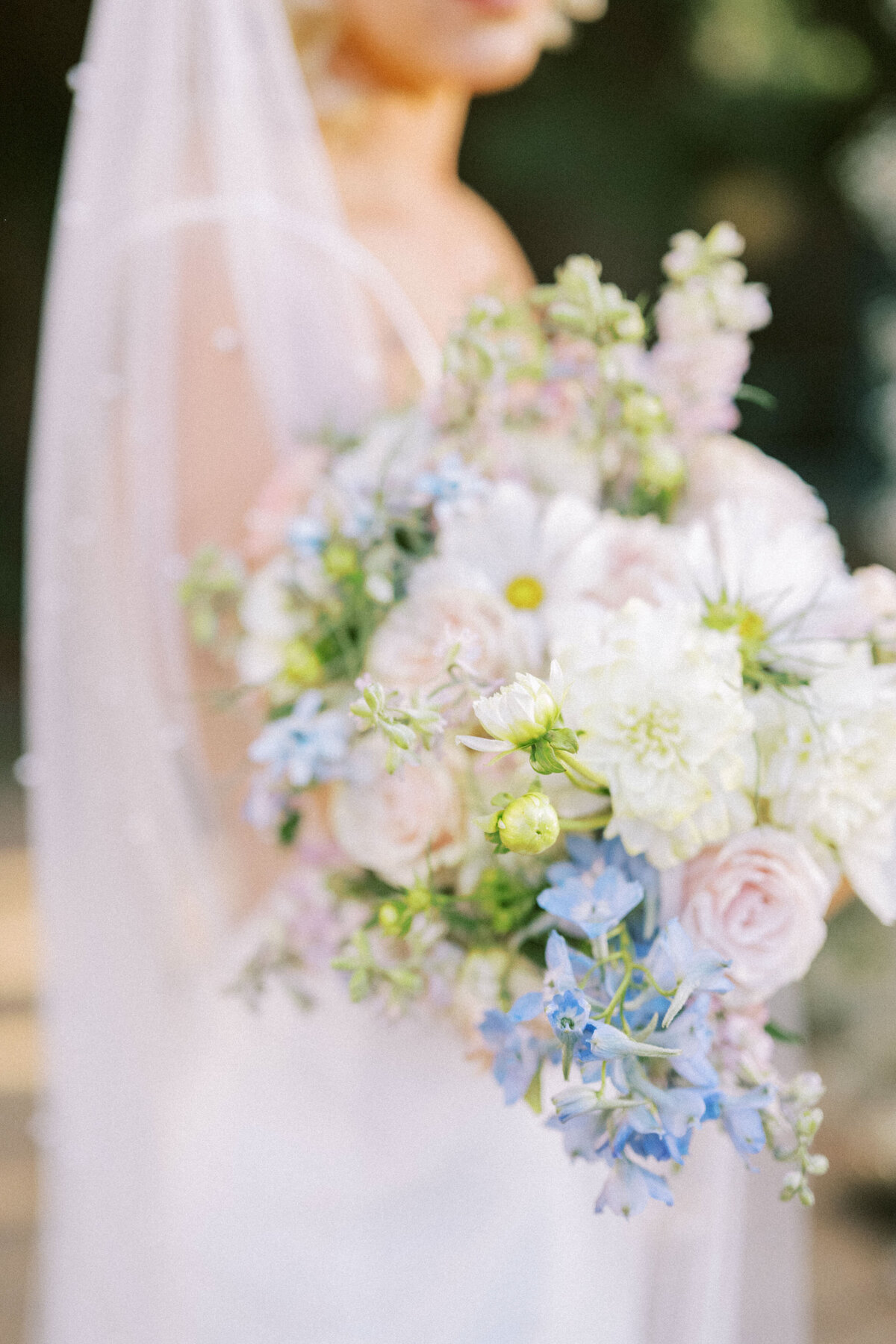 bridal-bouquet-with-white-blue-blush-flowers