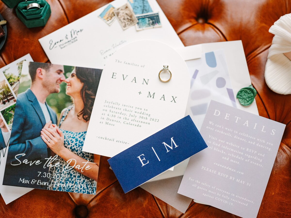 Light purple and navy blue wedding details including invitation and save the date.