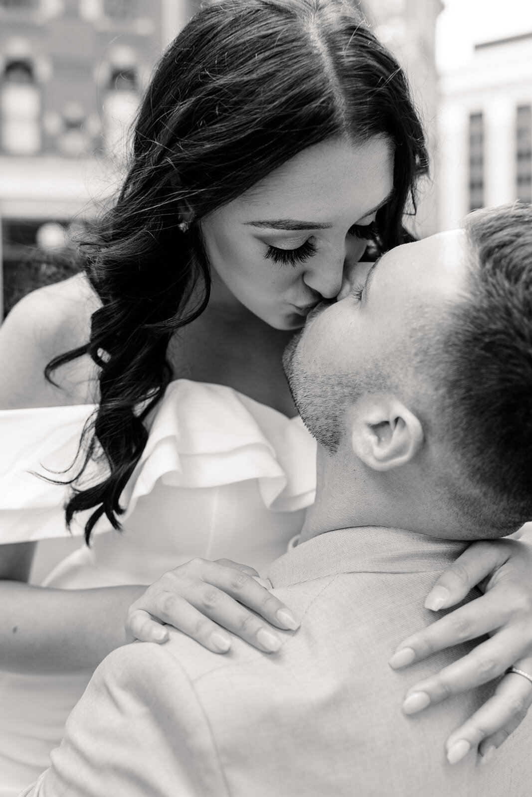 a woman kissing her fiance