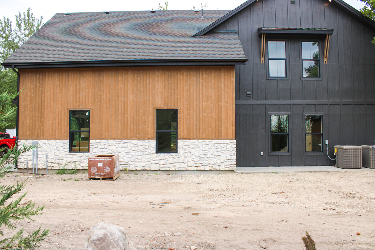 home with black exterior in process of being built on private grounds