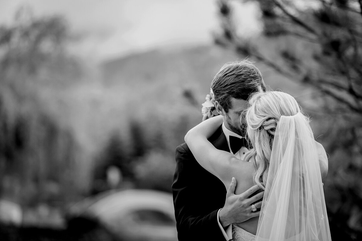 Bride and Groom embrace at the Broadmoor