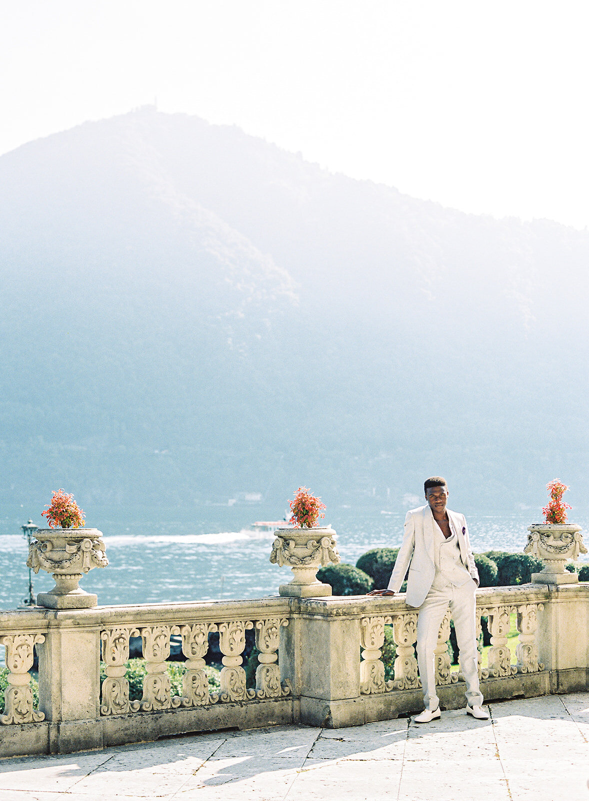 Groom in ivory textured tuxedo at Villa Erba wedding on Lake Como photographed by Italy Wedding photographer
