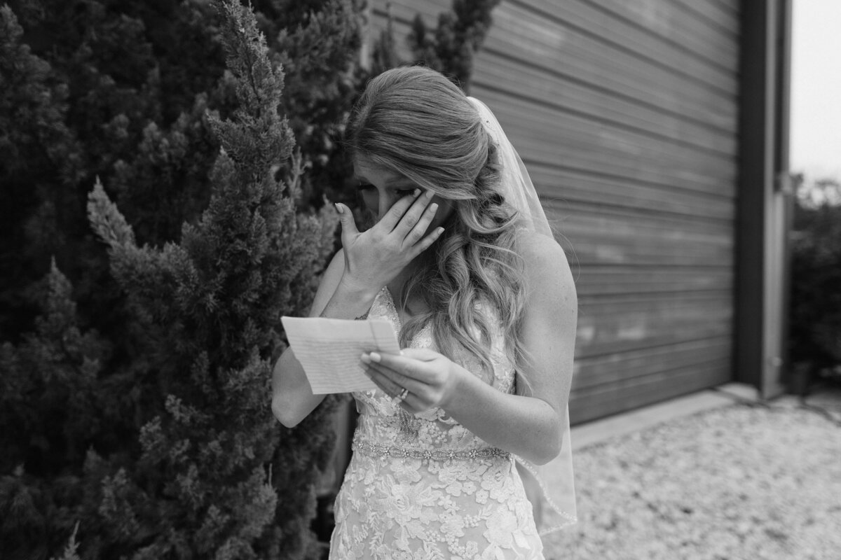 black and white image bride crying