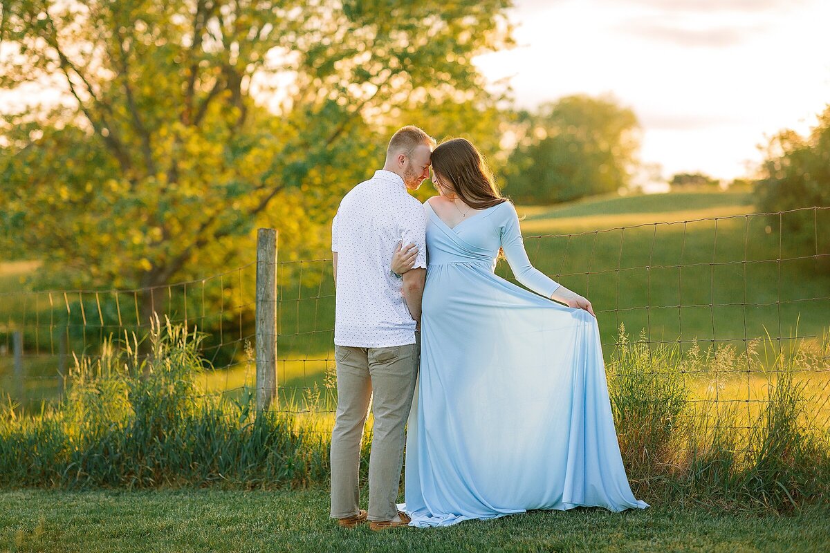 Maternity session in red dress with sunset in Harrisonburg, VA