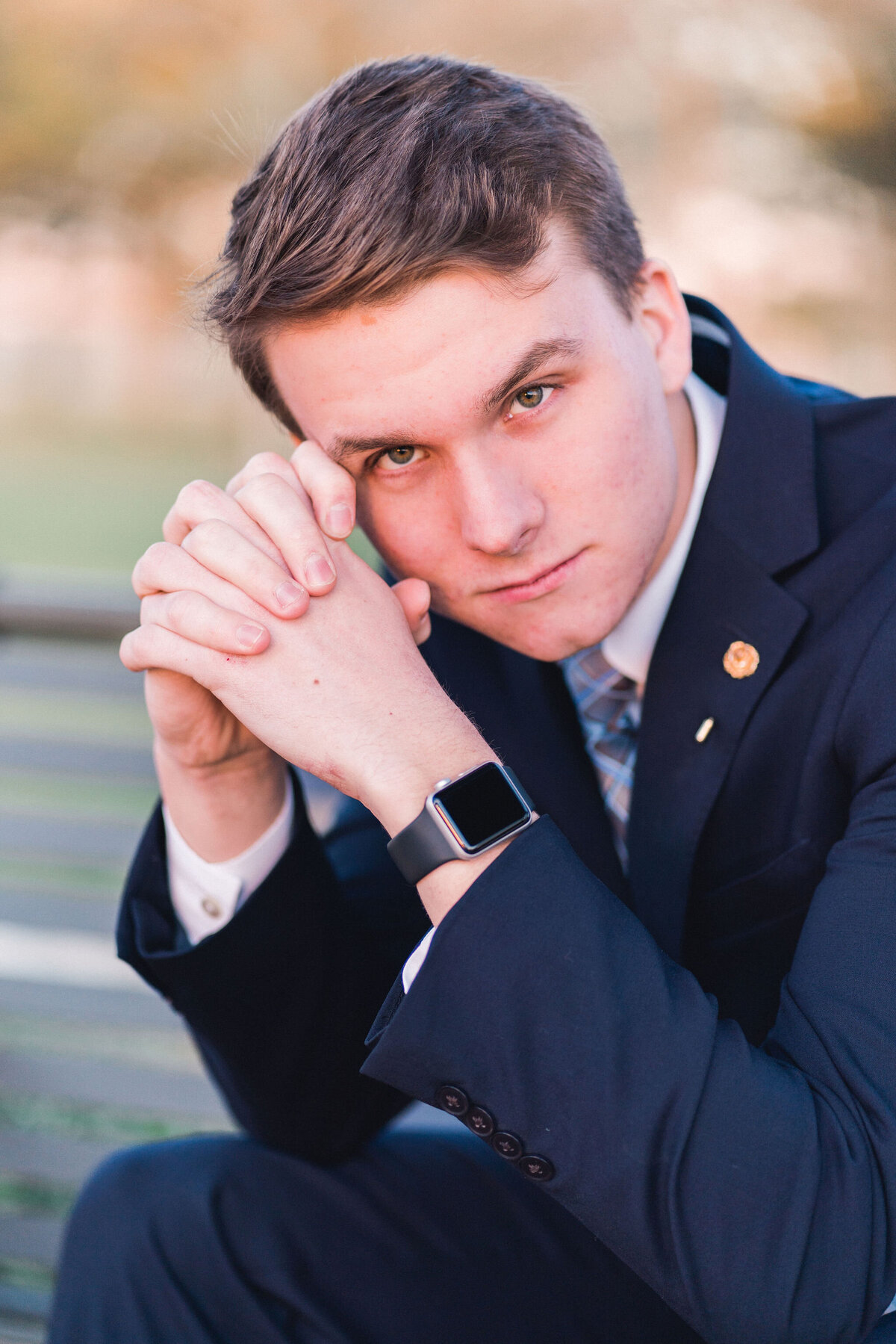 Austin senior boy in suit and tie. Outside in Austin Texas.