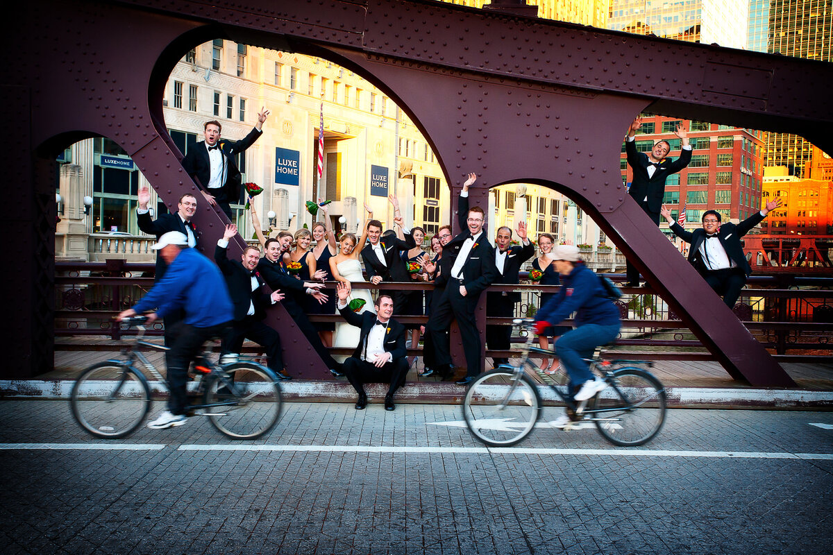 A fun bridal party portrait on a river bridge in Chicago