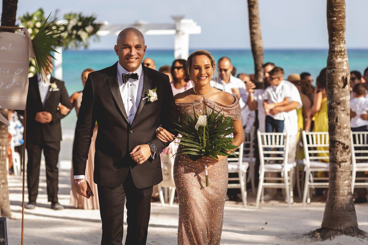 Bridal party walking from ceremony at Grand Palladium Colonial Resort, Riviera Maya wedding