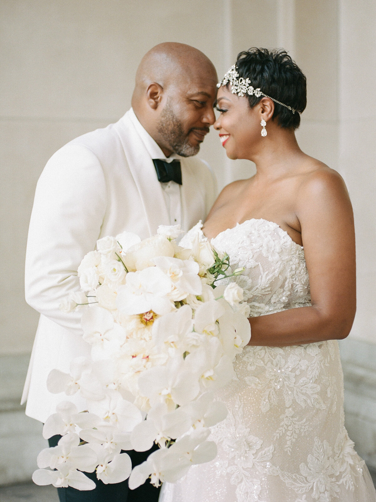 Black wedding couple with white orchid bouquet, art deco style in Detroit, Michigan