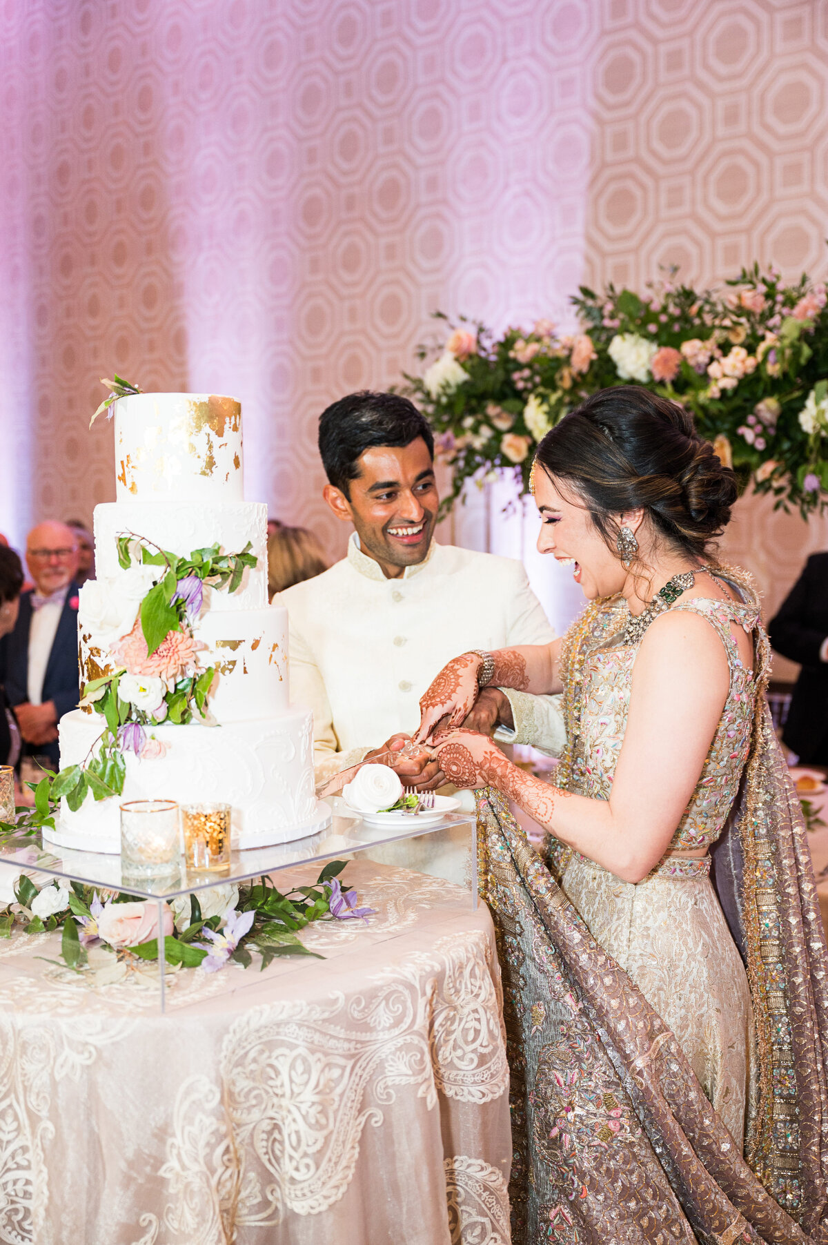 bride and groom cutting cake at their pakistani wedding at the fairmont hotel