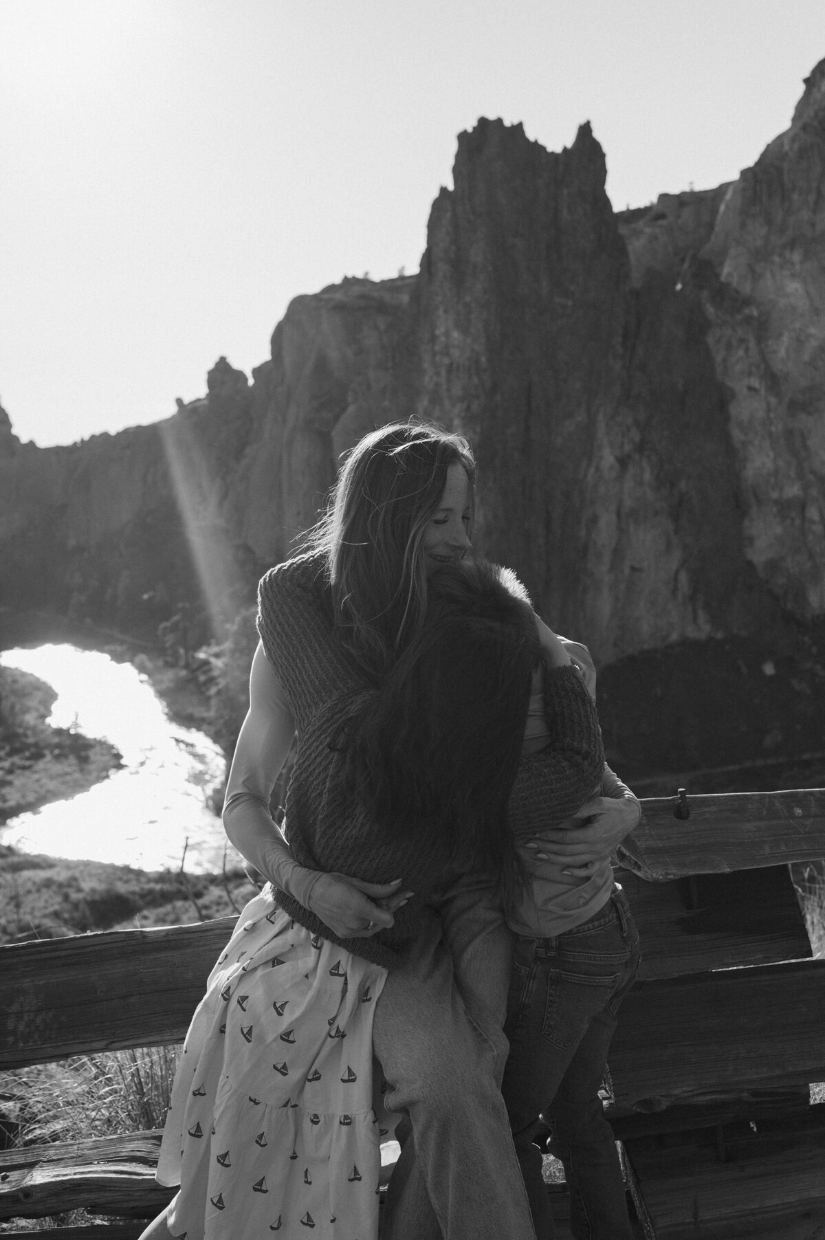 joyful moment of mother embracing her kids during a fun outdoor photoshoot at Smith Rock in Oregon