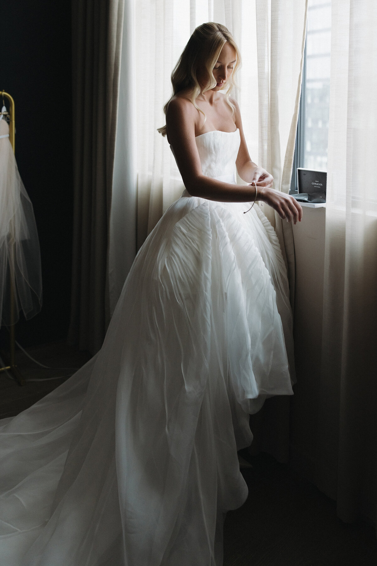 Film photography captures editorial bridal elegance at NOBU Hotel Chicago with Lauren Alatriste's fashion forward approach, creating luxury wedding imagery that combines sophisticated editorial aesthetics with authentic preparation moments.