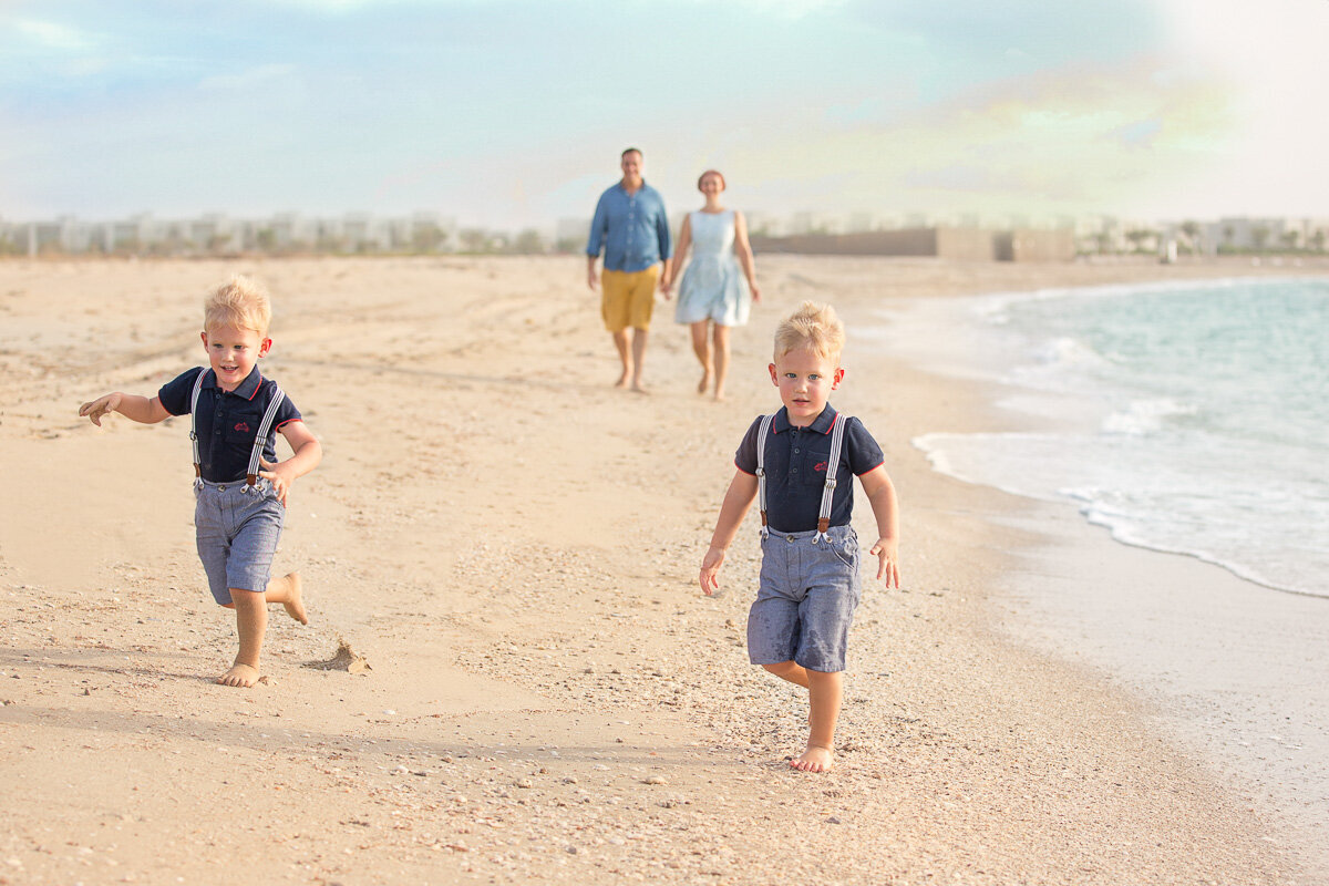 family-running-on-the-beach