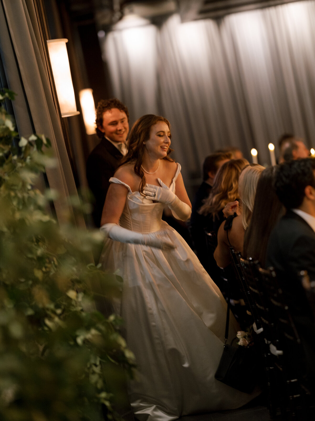 A photo of the bride and groom during the reception  at their Astorian wedding in Houston.