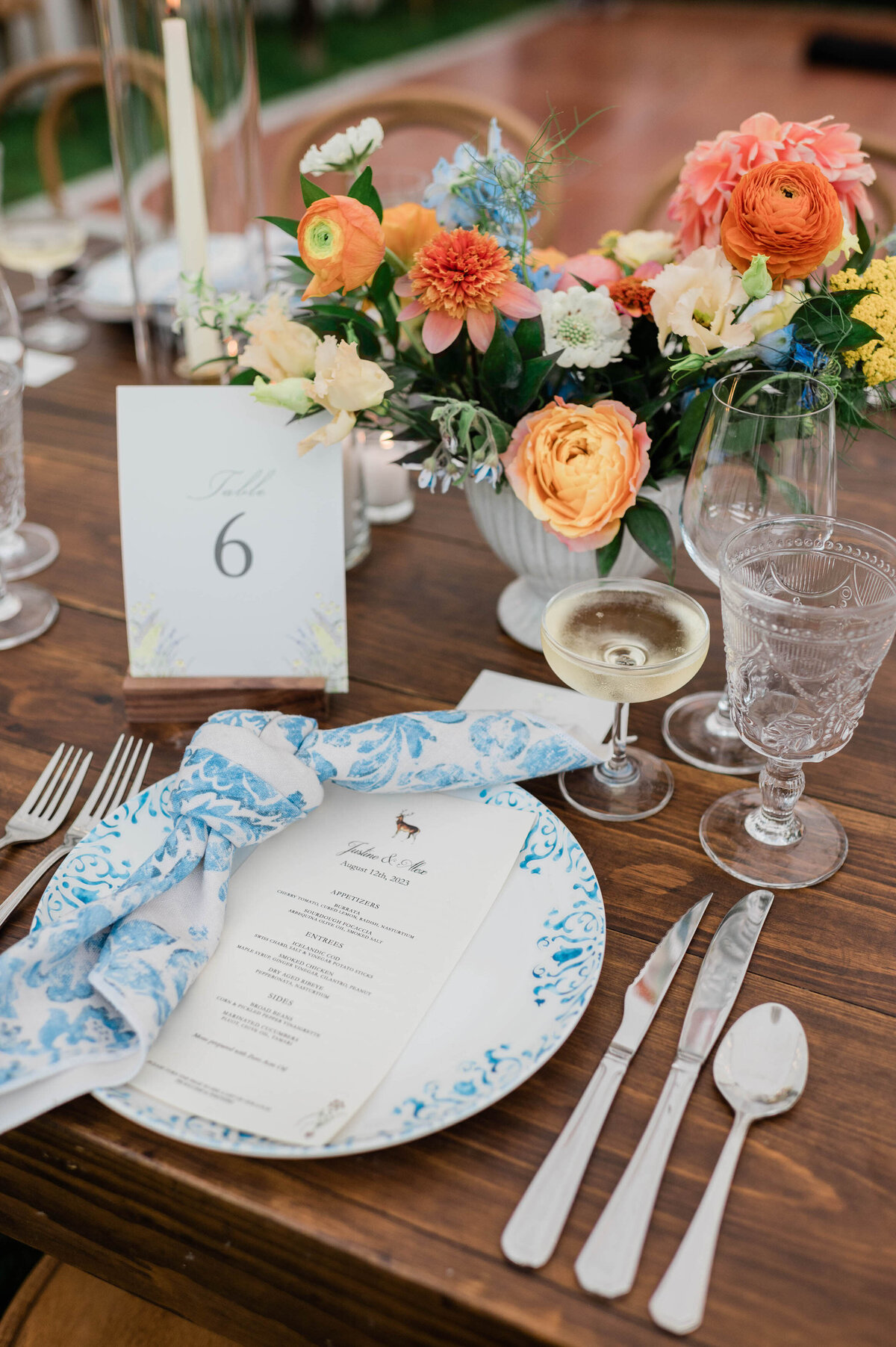 Wedding reception place setting with the dinner menu