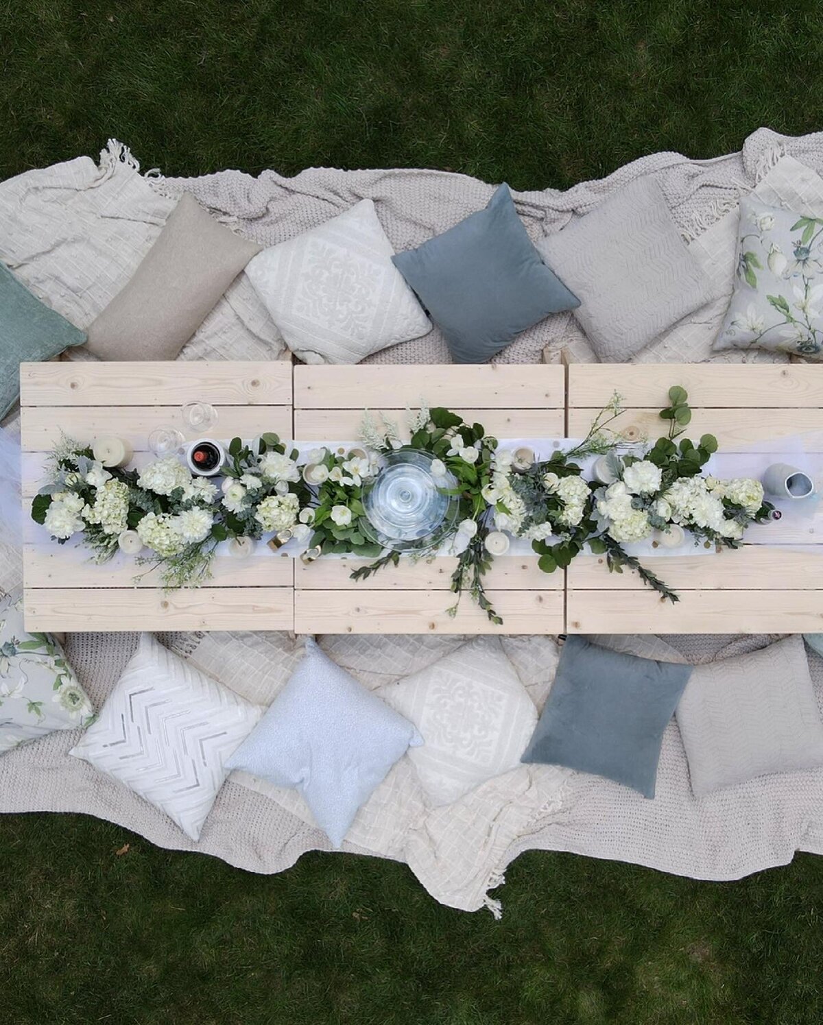 shot from above of white elegant luxury picnic set up outdoors