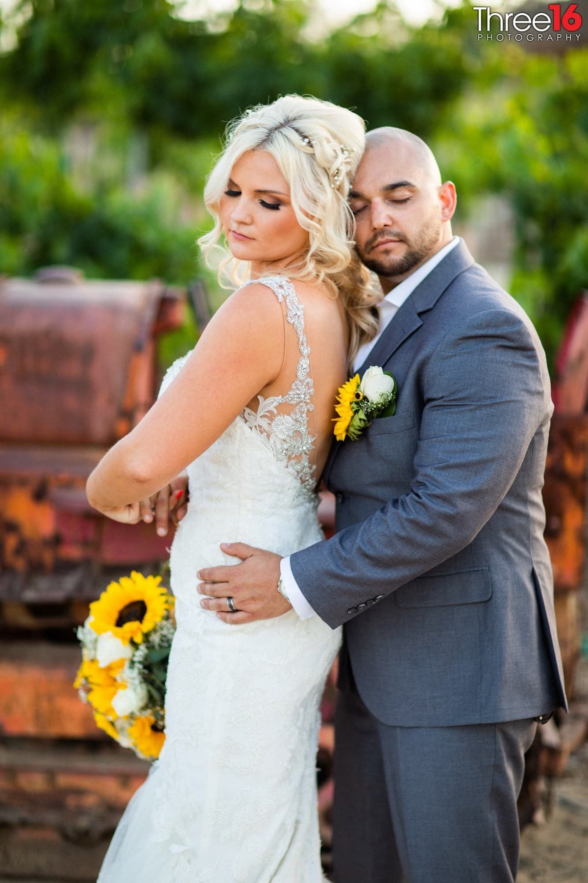 Newly married couple pose for intimate photo