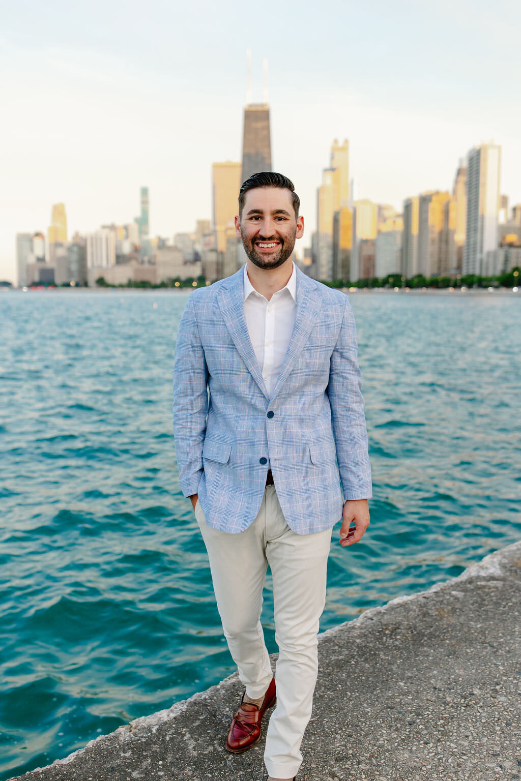 An engagement photography session at The Wrigley Building and North Ave Beach in Chicago, Illinois - 37