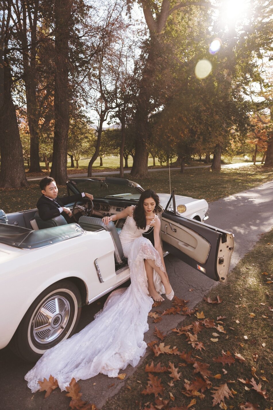 Autumn wedding shoot at Millbrook, Arrowtown. Vintage car & helicopter.