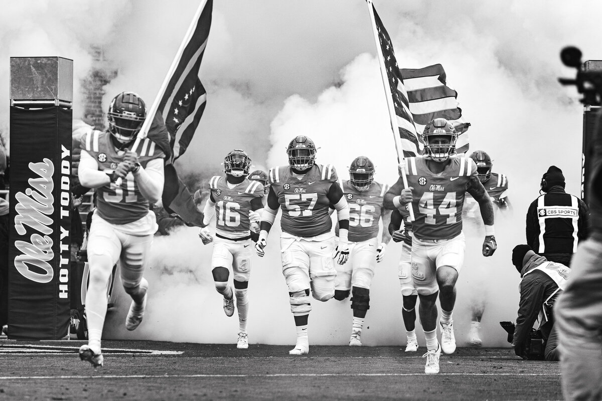 Ole Miss Football team running out of tunnel before game vs Alabama in Oxford, MS.