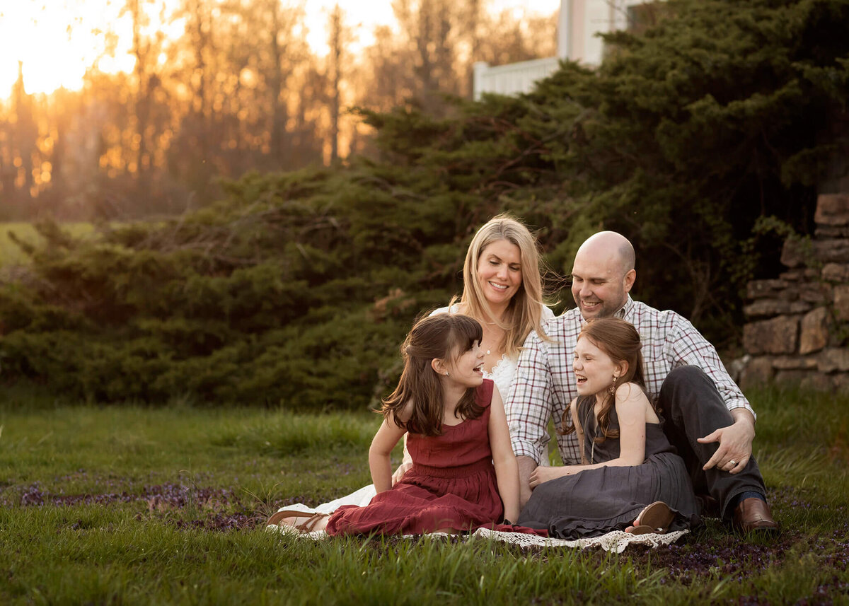 NJ portrait photographer captures family together in Chester, NJ sitting together on blanket