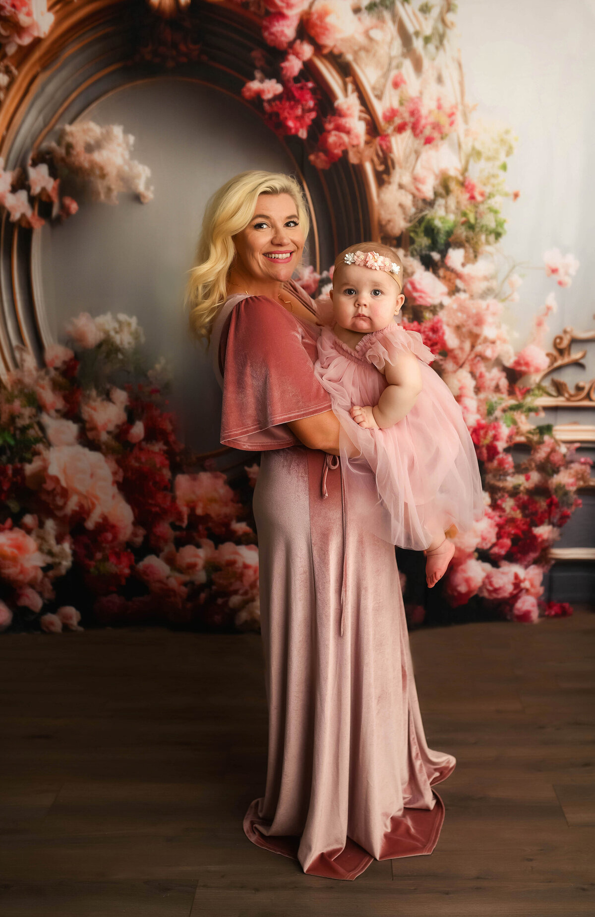Mother embraces her baby during Milestone Birthday Portraits in Asheville, NC.