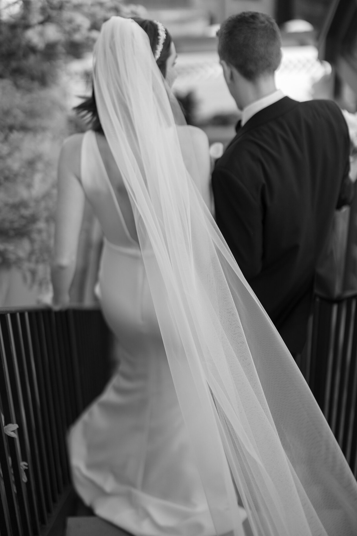 Bride and Groom walk down steps after their rooftop ceremony in Boston.
