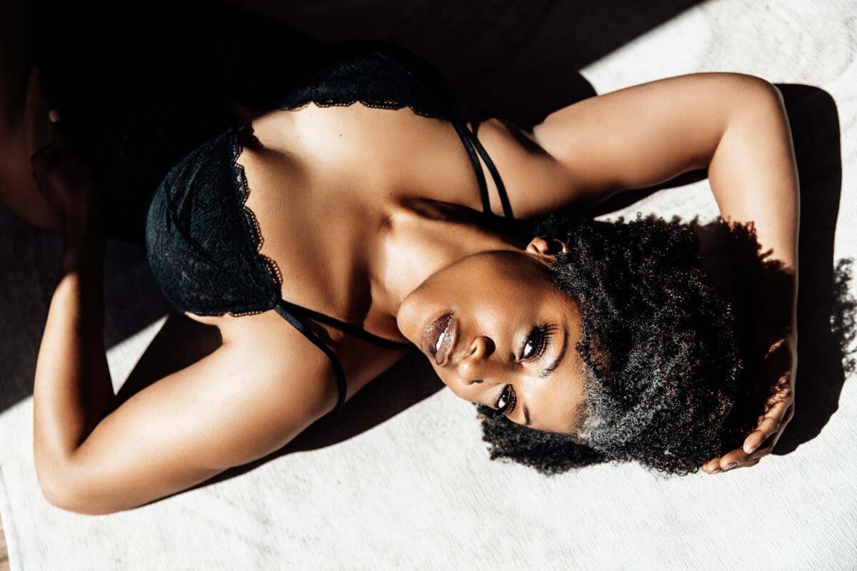 High contrast boudoir portrait of black woman