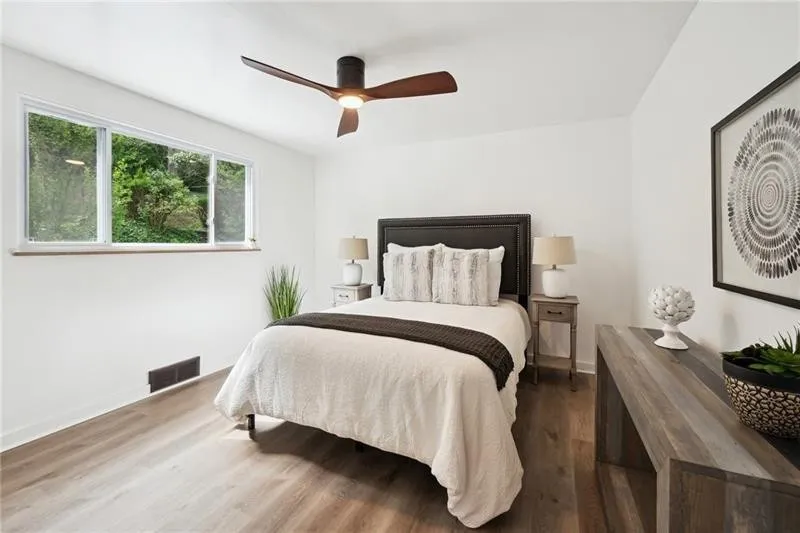 Bright and inviting staged bedroom showcasing functional design for quick home sale