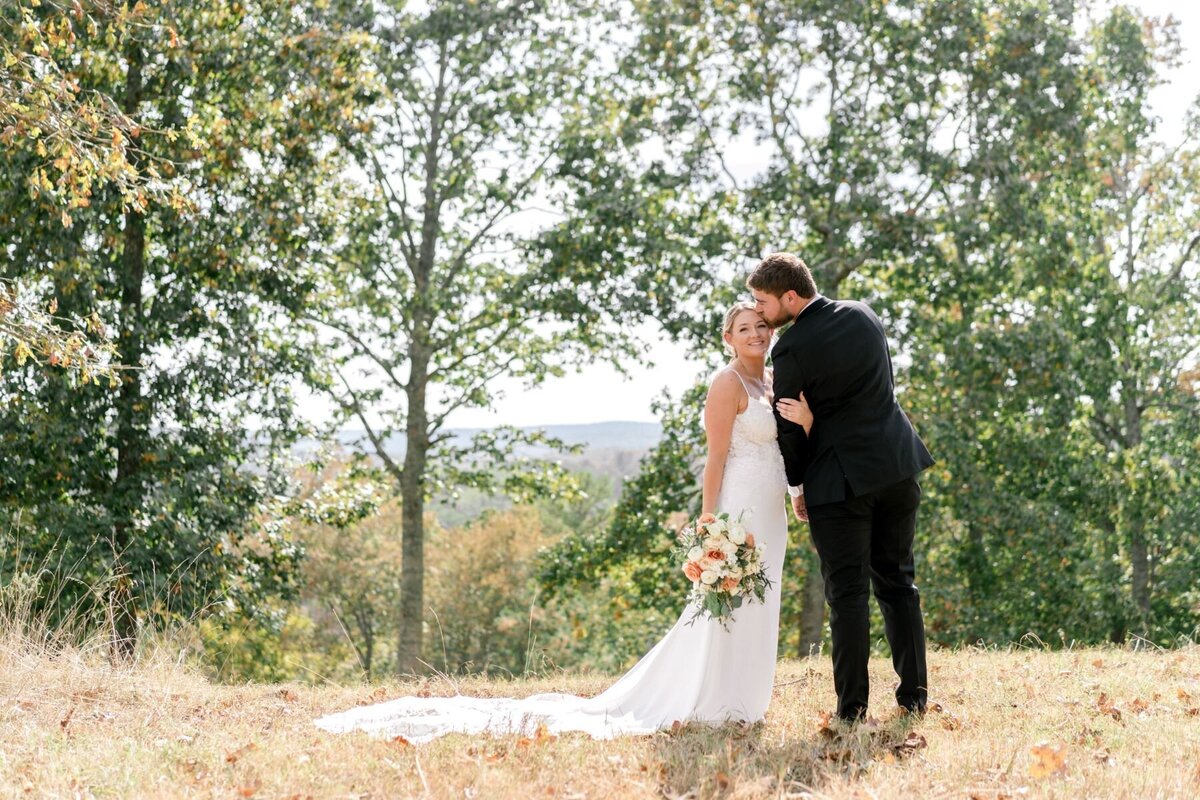 bride-and-groom-mountains-kiss-lewallen-farms-waleska-ga