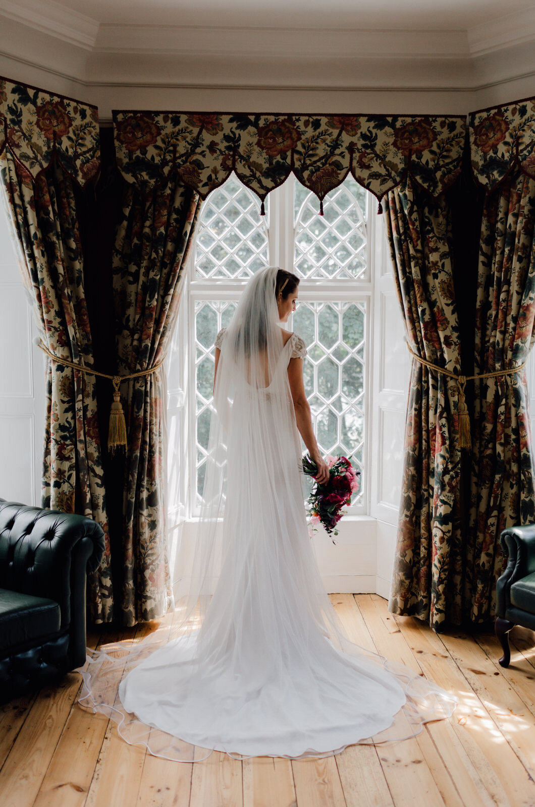 bridal-photo-of bride-standing-in-large-ashley-park-house-window