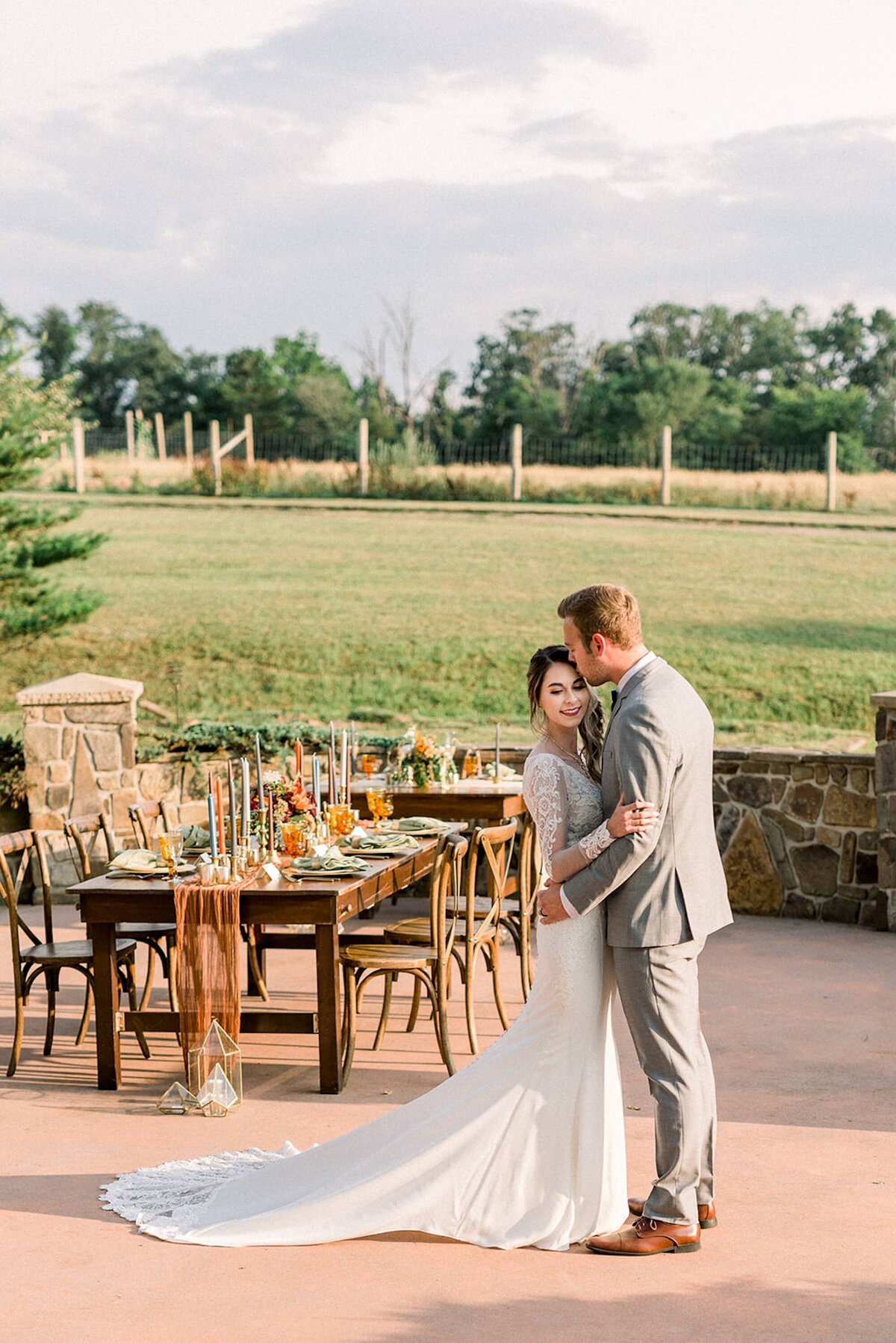 Bride and groom with wedding table outdoor wedding