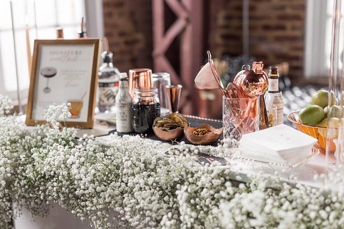 wedding bar decorated with babys breath flowers